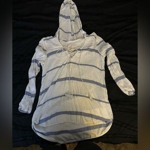 It is a blue and white light jacket with a hood.